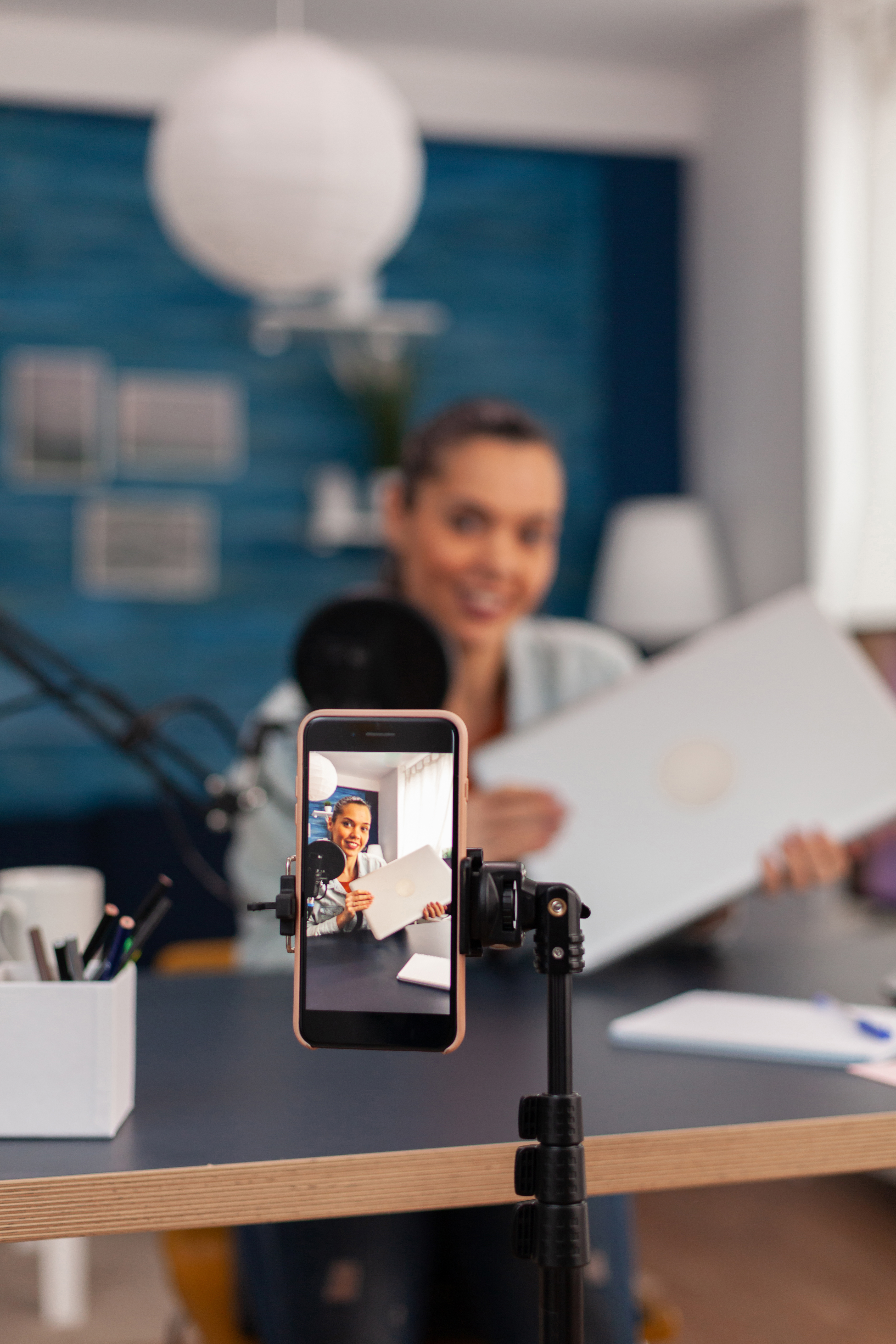 closeup-of-smartphone-recording-product-review-mobile-phone-filming-woman-presenter-doing-vlog-testi